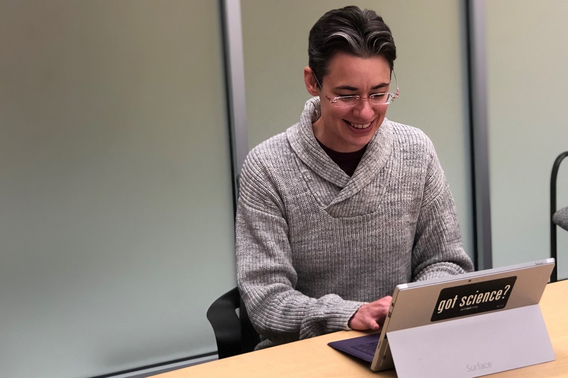 Student analyzing data on tablet